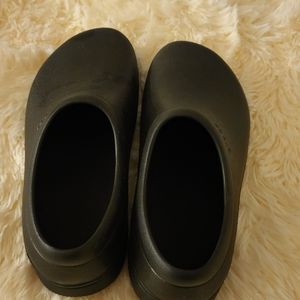 On the clock crocs .